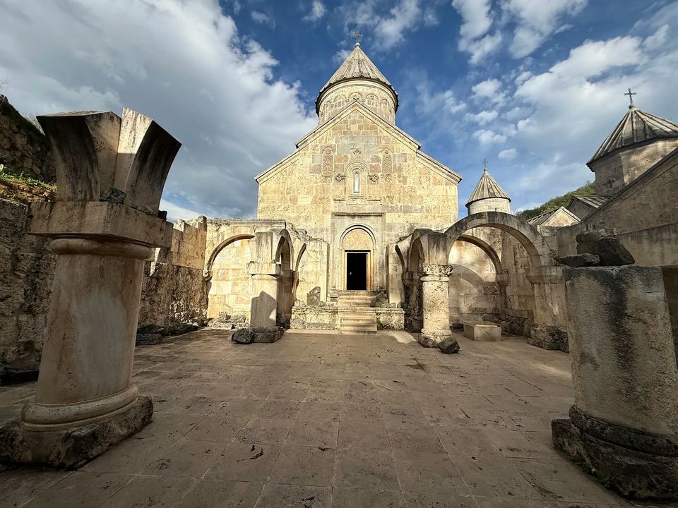 Courtyard of Haghartsin Monastery with the main church behind ruined arches